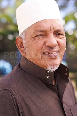 Buy stock photo Senior, man and portrait of muslim outdoor with a smile in garden to relax on holiday in retirement. Arab, person and travel on vacation in summer to park to enjoy nature and trees in environment