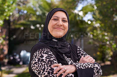 Buy stock photo Portrait of a mature muslim woman standing outside