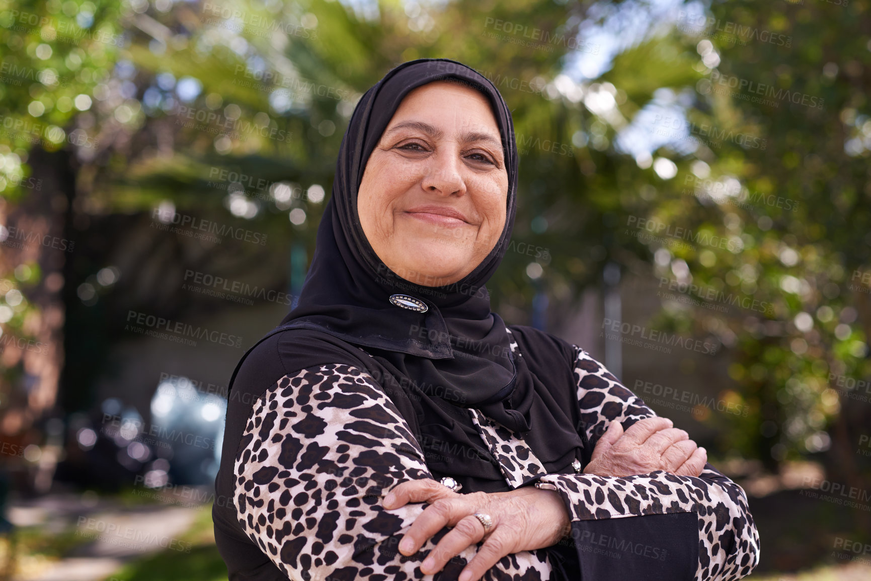 Buy stock photo Portrait of a mature muslim woman standing outside
