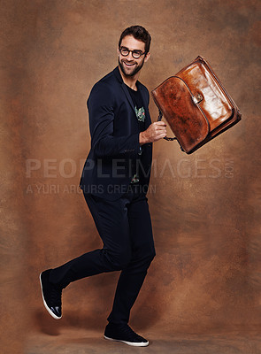 Buy stock photo Man, bag and smile for fashion, style and trendy for aesthetic, clothes and comfort in studio. Model or young male and happy with briefcase for walk, retro and cool for vibrant and joy indoor 
