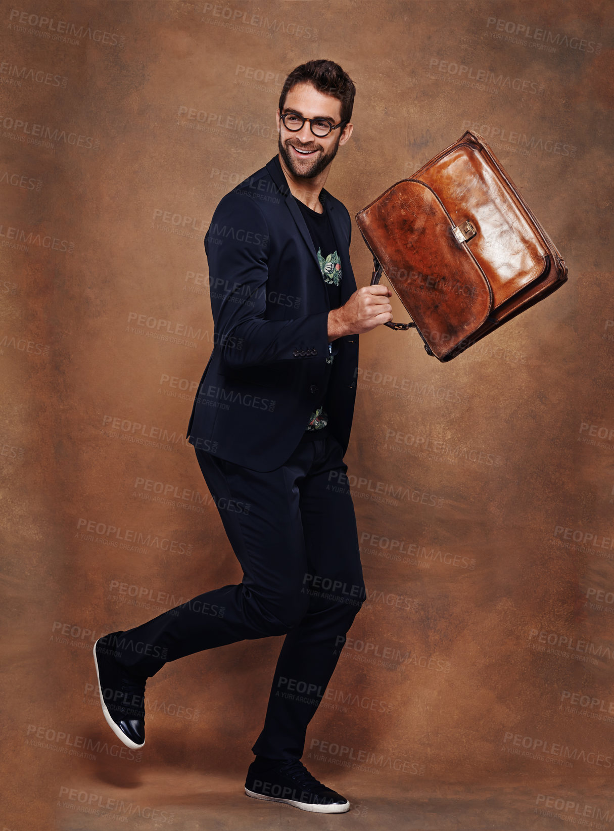 Buy stock photo Man, bag and smile for fashion, style and trendy for aesthetic, clothes and comfort in studio. Model or young male and happy with briefcase for walk, retro and cool for vibrant and joy indoor 