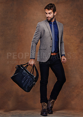 Buy stock photo Confident, businessman and fashion with bag, proud on studio background. young man and leather handbag, style and trendy suit pose for consultant in startup, for professional career and corporate job