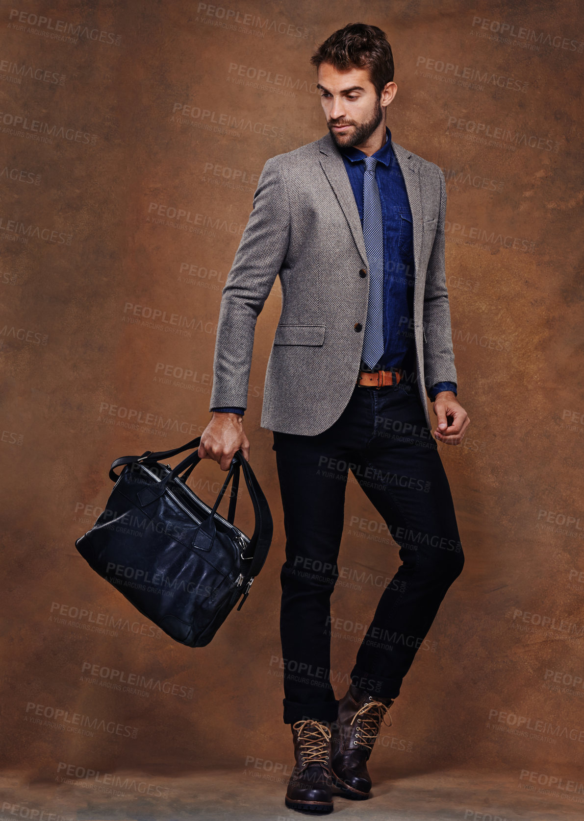 Buy stock photo Confident, businessman and fashion with bag, proud on studio background. young man and leather handbag, style and trendy suit pose for consultant in startup, for professional career and corporate job