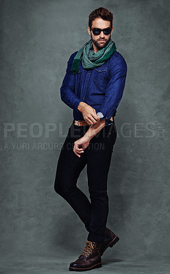 Buy stock photo Fashion, confidence and man or model in studio isolated on a gray background mockup space. Serious, person and roll sleeve on shirt for style in casual clothes, trendy or cool sunglasses with jeans