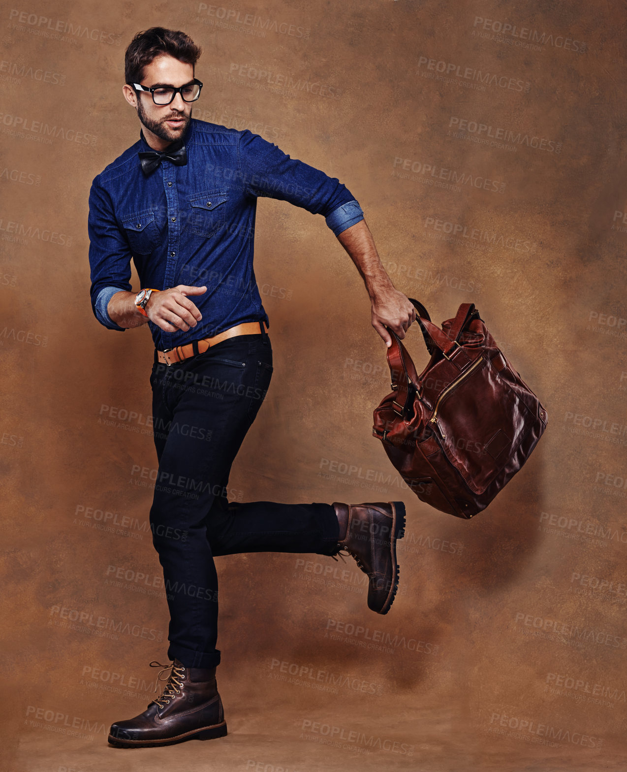 Buy stock photo Travel, bag and man with fashion walking in studio, background and mockup for business vacation. Formal, style and model with luxury luggage for airport, journey to Italy and Italian leather shoes