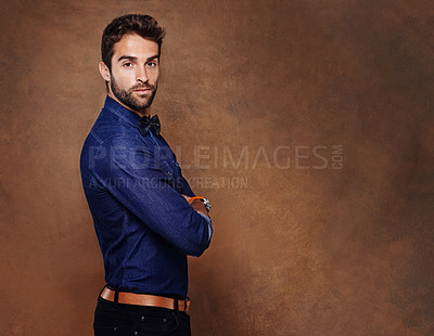 Buy stock photo Fashion, portrait and business man in studio with arms crossed for confidence, serious or corporate on brown background. Entrepreneur, consultant and male person for formal, styling or trendy clothes