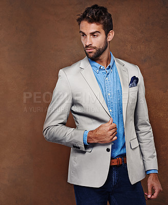 Buy stock photo Serious, man and fashionable in studio background for confidence, style and trendy suit pose. Italian male person, model and classy gentlemen on backdrop space for professional luxury clothes 
