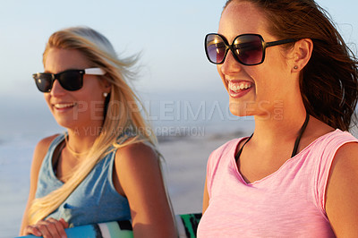 Buy stock photo Summer, beach and woman friends surfing outdoor in nature together while on tropical holiday or vacation. Smile, sunglasses and a happy young female surfer with her friend on the coast to surf