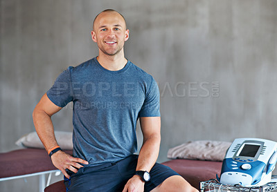 Buy stock photo Shot of a trainer sitting by equipment in a gym