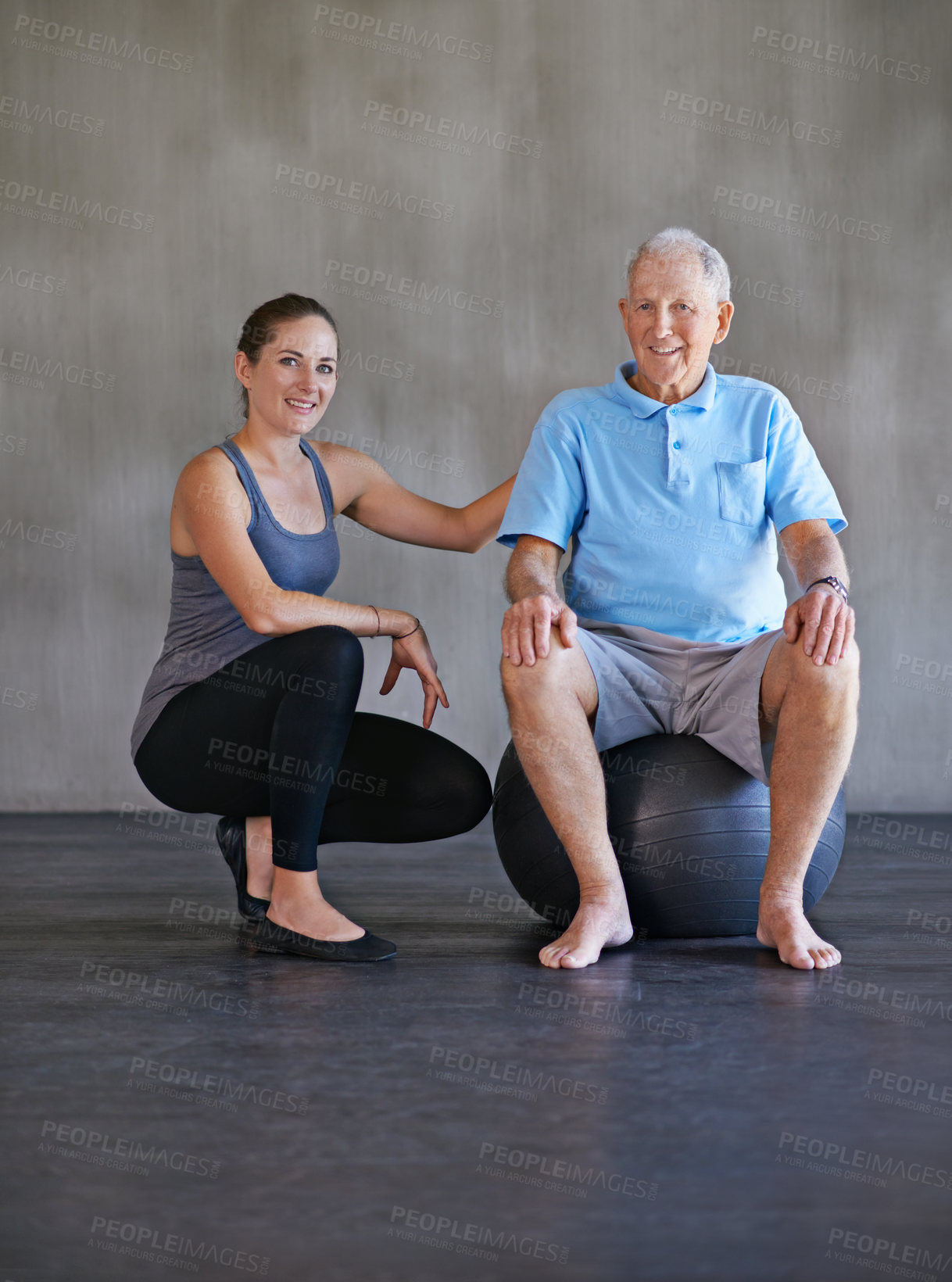 Buy stock photo Exercise ball, smile and physiotherapist with patient for muscle exercise consultation at clinic. Physical therapy, happy and portrait of healthcare worker helping senior man at rehabilitation center