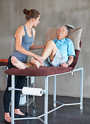 Buy stock photo Shot senior man visiting a Shot of a senior man at a physical therapy session