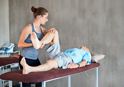 Buy stock photo Physiotherapist, legs and elderly man with physical therapy exercise at rehabilitation center. Medical, help and therapist with senior male patient with consultation for muscle injury at clinic.