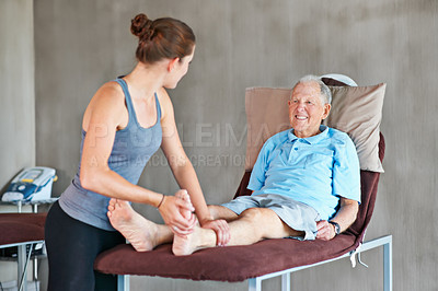 Buy stock photo Therapist, legs and elderly man with physical therapy exercise at rehabilitation center. Medical, help and physiotherapist with senior male patient with consultation for muscle injury at clinic.