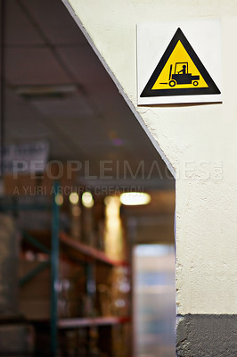 Buy stock photo Warning, sign and forklift with triangle or symbol for alert, precaution or safety at warehouse or factory. Empty room with hazard billboard for beware of vehicle, lifting or transport at manufacture