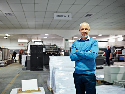 Buy stock photo Portrait of a man standing proudly in a printing factory