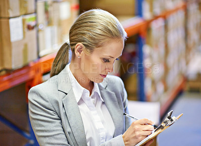 Buy stock photo Inspector, writing and woman in warehouse with inventory for quality control and freight distribution. Logistics, person and wholesale supplier with stock checklist in supply chain for inspection