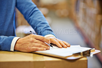 Buy stock photo Hand, writing and inspector with closeup of clipboard in warehouse for inventory, quality control or freight distribution. Logistics, man or wholesale supplier with stock checklist for box inspection