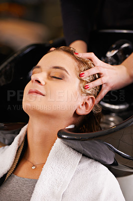 Buy stock photo Massage, washing and woman at sink with hairdresser for professional haircare, cleaning or luxury treatment. Grooming, hair care and client at salon basin with soap, relax and small business service