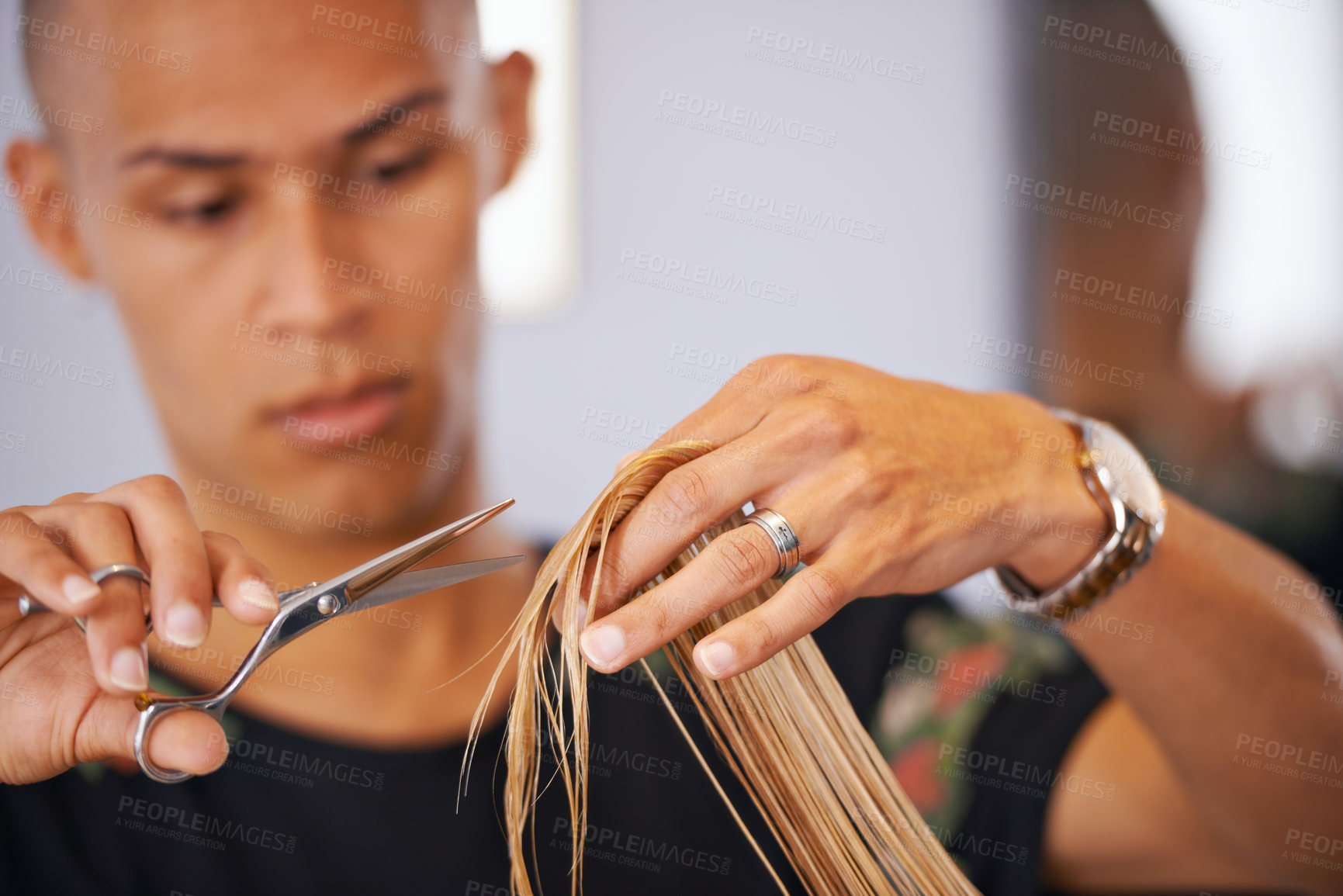 Buy stock photo Cropped shot of a male hairdresser cutting a client's hair