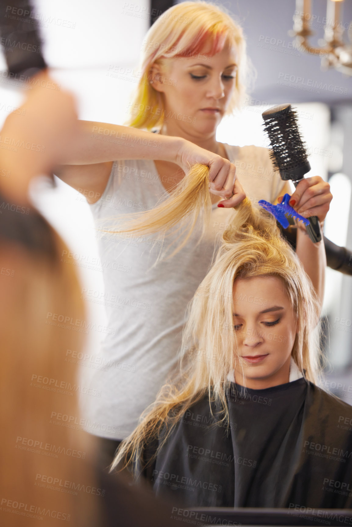 Buy stock photo Hairdresser, salon and haircut for female client, comb and clip for hair dry during appointment. Service, beautician and haircare from stylist at small business, beauty spa and hairstylist career