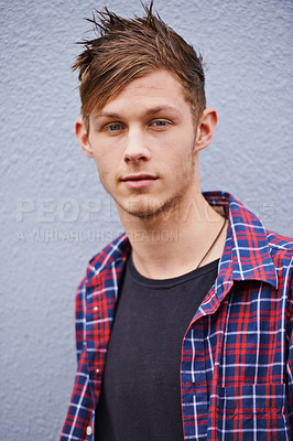 Buy stock photo Portrait of a trendy young man standing outside