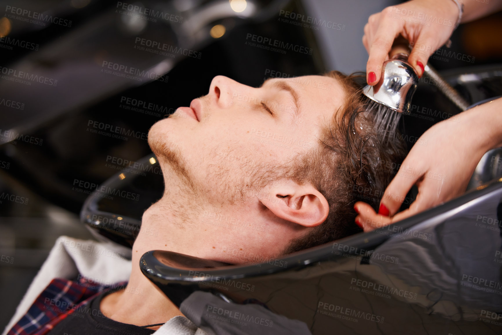 Buy stock photo Water, washing and man at basin with hairdresser for professional haircare, cut or luxury treatment. Grooming, hair care and client at salon for rinse, shampoo and small business with happy service