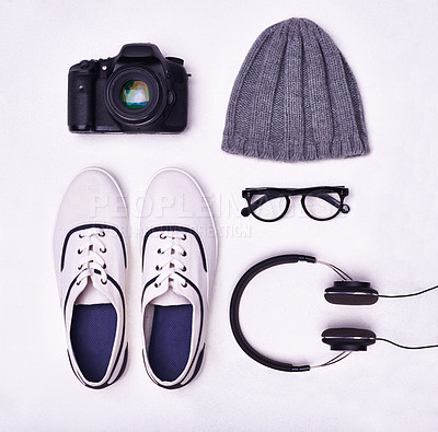 Buy stock photo Shoes, glasses and headphones for music, fashion and camera for photographer from above view angle on studio background. Lens, beanie hat and sneakers for magazine shoot, latest style and cool shoot