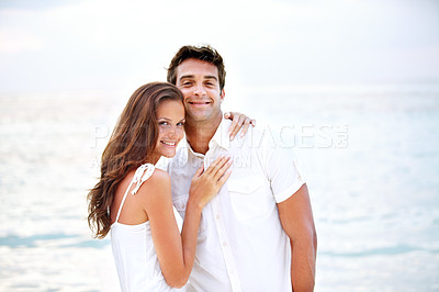 Buy stock photo Happy couple, portrait and hug by beach in nature, love and travel on honeymoon adventure in outdoor. Young man, woman and face of bonding in marriage, sea and together on summer getaway in cape town