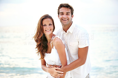 Buy stock photo Happy couple, portrait and hug on beach for love and travel on honeymoon adventure in sunshine. Man, woman and smile face for bonding in marriage, touch and together on ocean vacation in cape town