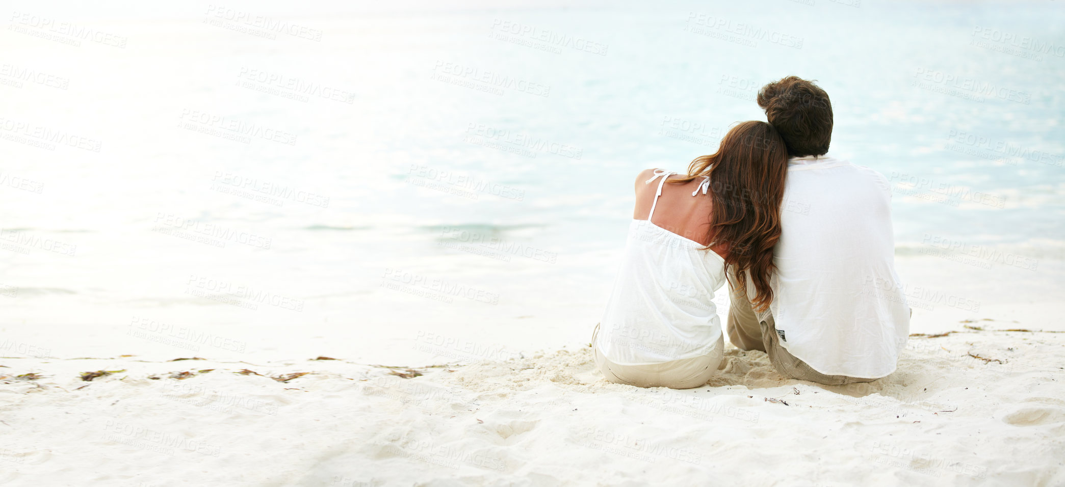 Buy stock photo Young couple, back and love at beach outdoors for mockup, relationship and marriage. Calm, man and woman with space for support, care and flare on holiday or vacation together in nature for travel