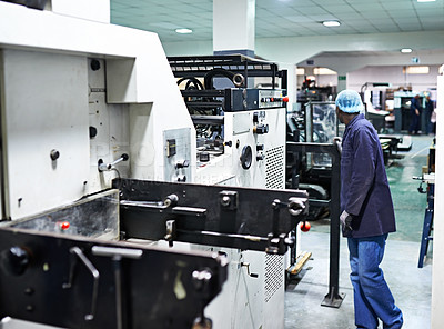 Buy stock photo Man, printer and machine in factory for packaging, system and industry for manufacturing and distribution. Worker and look for job, control and production for assembly line, printing and supplier