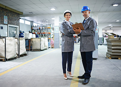 Buy stock photo Professional, people and packaging warehouse with clipboard by working together checking checklist for manufacturing factory as team. Organised, mentor and teaching employee stock inventory for job