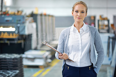 Buy stock photo Woman, clipboard and factory in portrait for logistics with quality assurance in facility for inventory. Confident female person, checklist and manufacturing with storage, industry and distribution