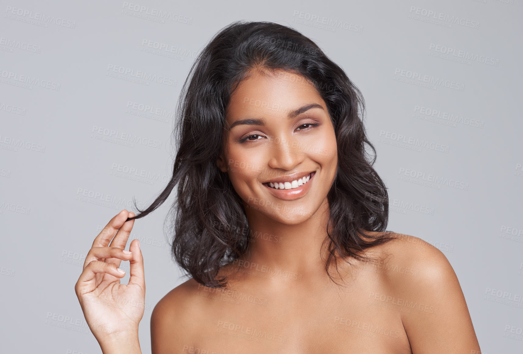 Buy stock photo Happy woman, hair and portrait for beauty with cosmetics, salon treatment for texture and growth on grey background. Face, haircare and smile for shine, cosmetology and change with waves in studio