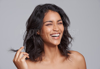 Buy stock photo Shot of a beautiful young posing over a gray background