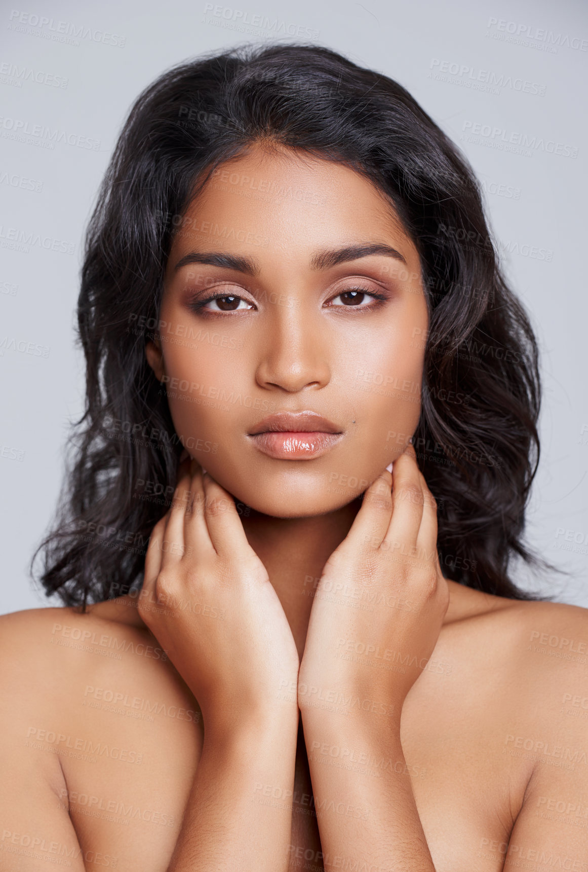 Buy stock photo Portrait, hands and woman in closeup for beauty, cosmetics and makeup serious isolated on studio background. Female person, gen z girl and lady with skin for self care, dermatology and treatment