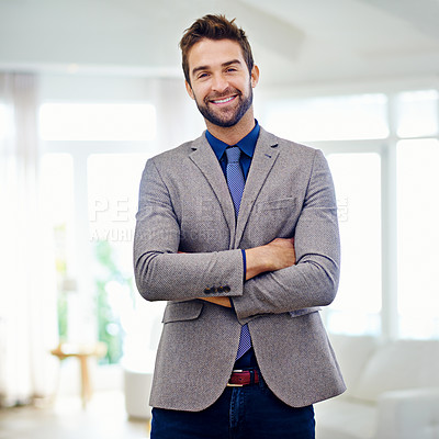 Buy stock photo Man in a conptemorary suit smiling at the camera with his arms folded