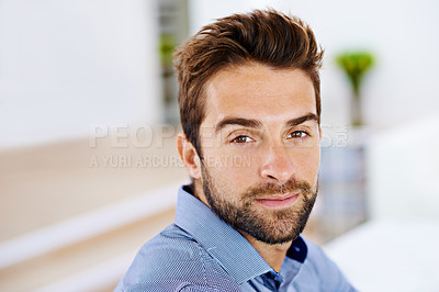 Buy stock photo Serious, face and portrait of man in house, home and living room to relax for holiday, break and weekend. Male person, gentleman and gen z guy in apartment, bedroom and lounge for vacation in Spain