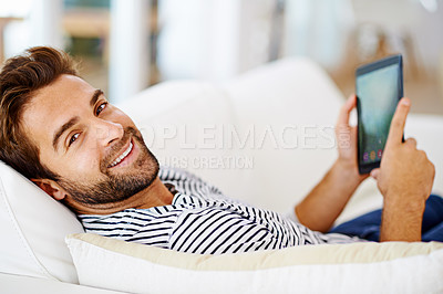Buy stock photo Couch, portrait or man with tablet for streaming movies or watching fun videos on a film website in home. Smile, online or happy person with technology to download on app or reading ebook to relax