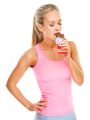 Buy stock photo Fitness, health and studio with woman and chocolate bar for unhealthy food choice to indulge for sweetness. Female person, isolated and white background with mockup, calories and eating candy