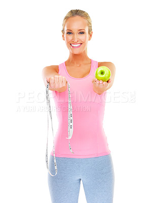 Buy stock photo Woman, portrait and studio with apple and measuring tape for healthy or slim body, dietitian or nutritionist for fit figure. Person, happy and fruit for diet and exercise for wellness or self care