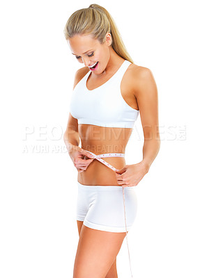 Buy stock photo Weight loss, measuring tape and woman in studio for wellness, healthy diet and fitness with white background. Happiness, stomach and female person for results in exercise, waist and body goals