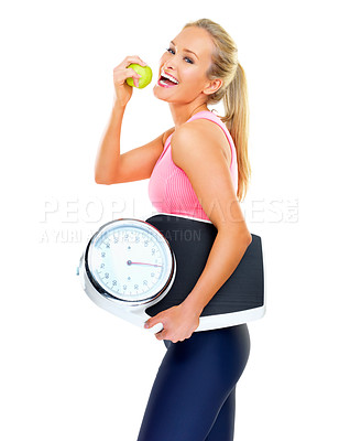 Buy stock photo Woman, fitness and scale in portrait with apple for nutrition, diet and health on white background. Girl, healthy and eating fruit in activewear for exercise, wellness and organic snack in studio