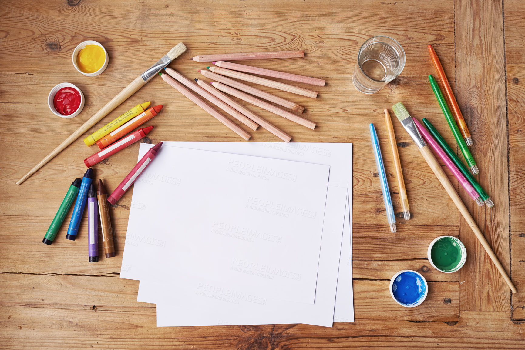 Buy stock photo Blank paper with painting supplies and pencils on a wooden table