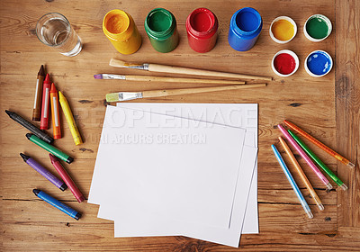 Buy stock photo Blank white paper with painting supplies and pencils on a wooden table