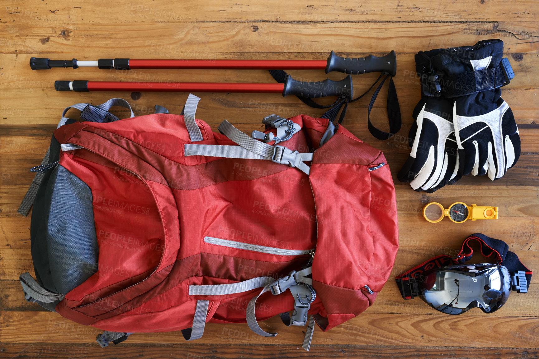 Buy stock photo Shot of various tools and equipment for a hiker laid out on a table