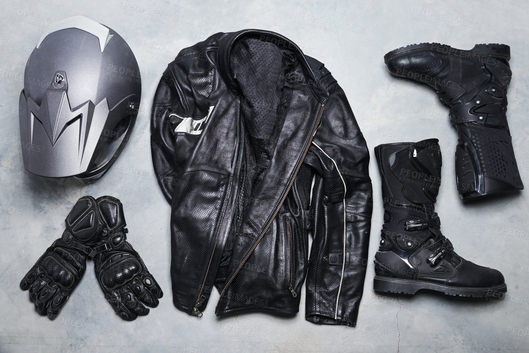 Buy stock photo High angle shot of biker gear against a gray background