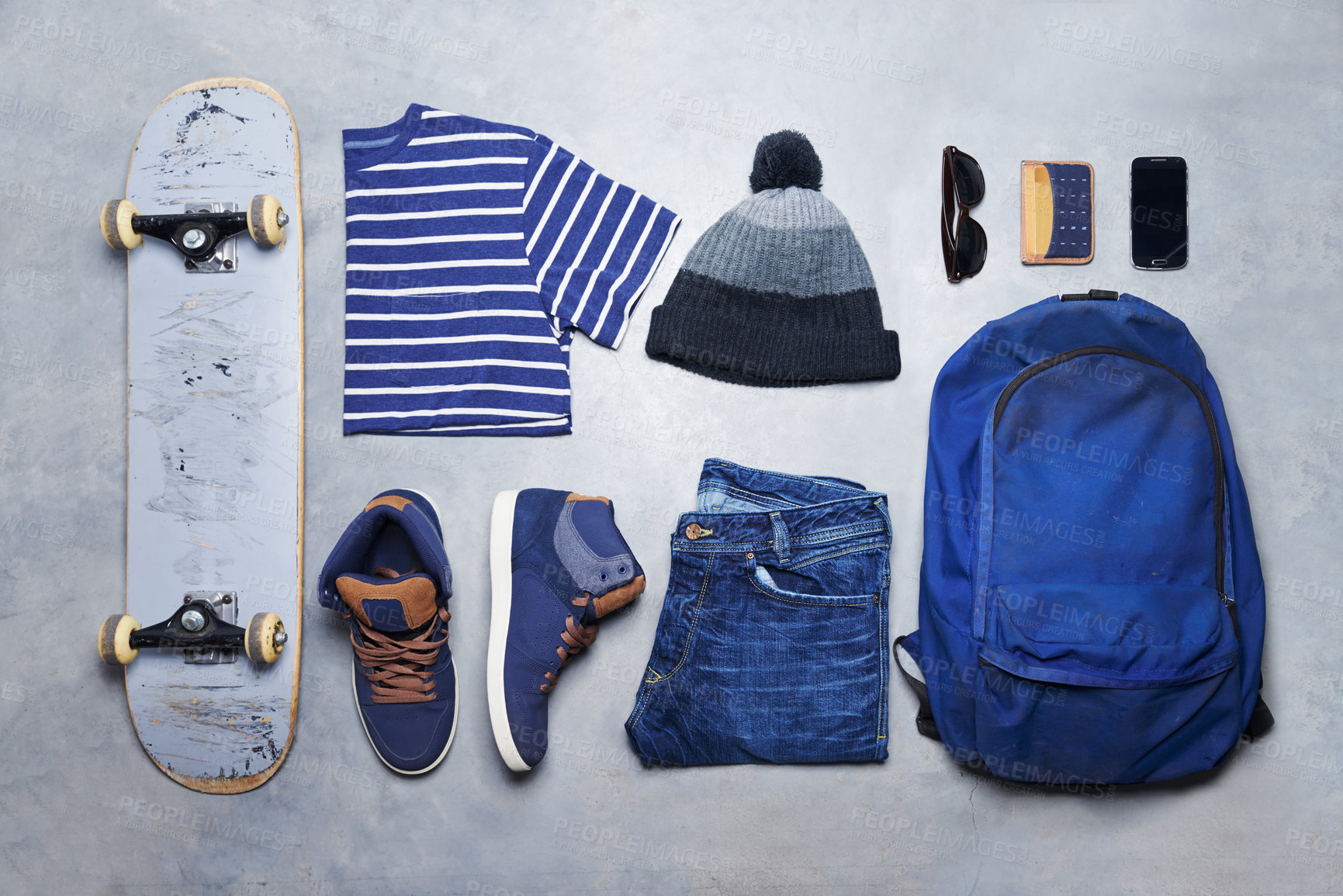 Buy stock photo Skater boy outfit, style or fashion laid out on the floor looking edgy, trendy and fashionable with a skateboard top view. Cool, stylish and casual monochrome skateboarding clothes, equipment or gear