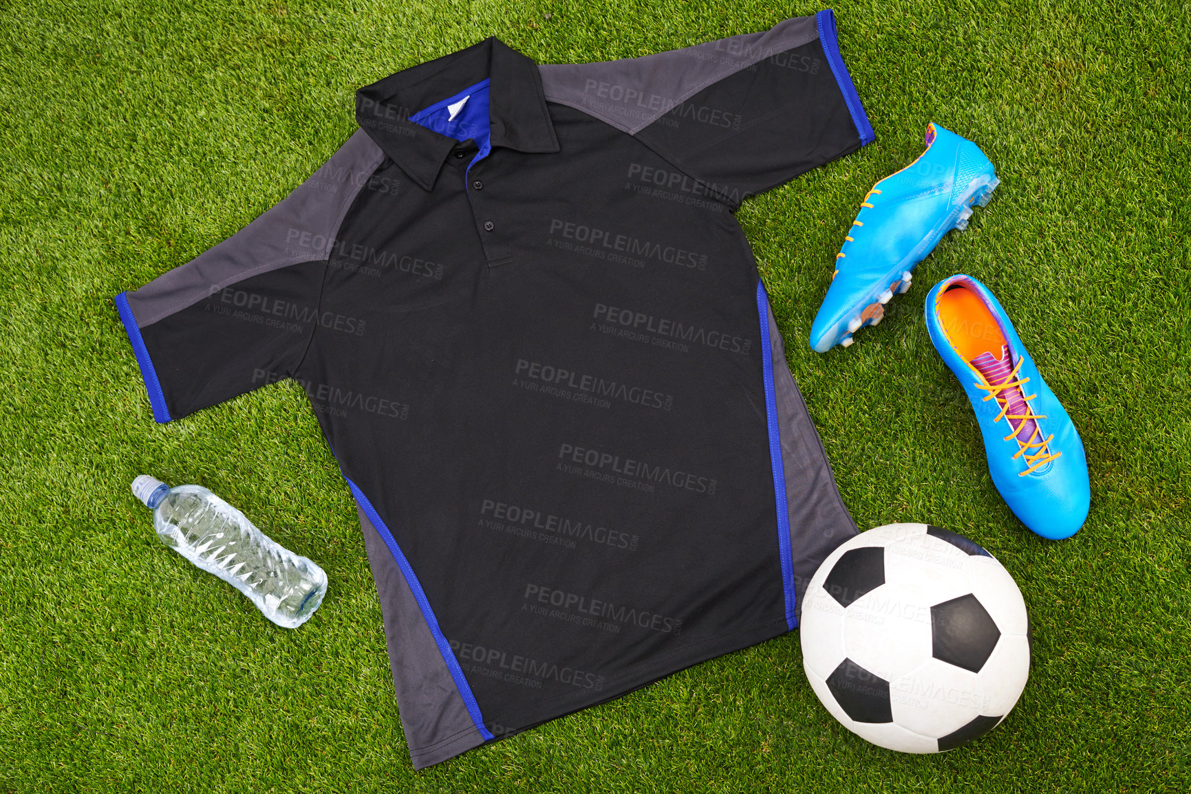 Buy stock photo Flatlay of sportswear or trendy soccer clothes, accessories and equipment on grass background. above view of modern sporty, active or fitness wear clothing style with water bottle, ball and trainers