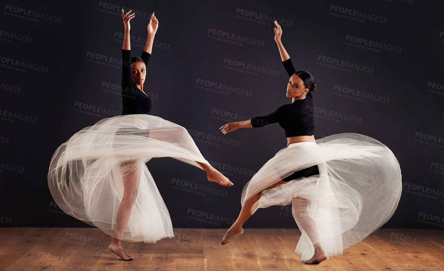 Buy stock photo Ballet, black people and ballerina in studio for dance routine, spinning and creative performance. Contemporary, dancing and young women for elegant art, movement and practice with dark background